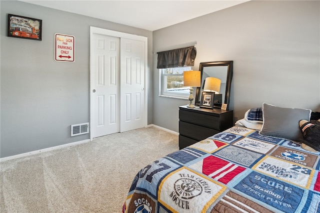 bedroom featuring a closet and carpet