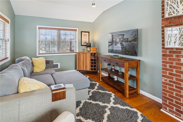 living room with hardwood / wood-style flooring and lofted ceiling