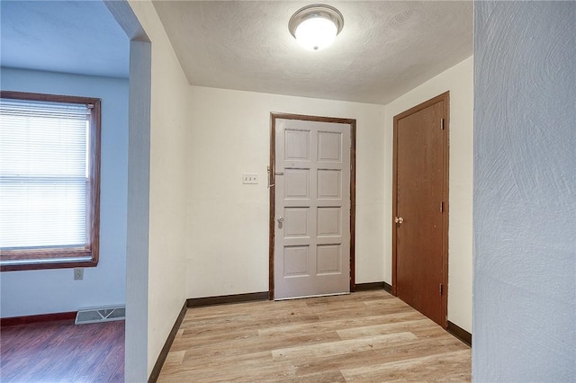 hallway featuring light hardwood / wood-style floors