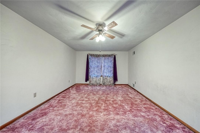 carpeted empty room with ceiling fan