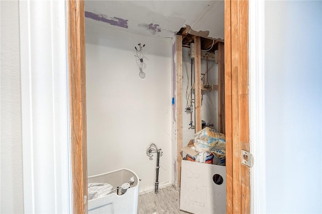 bathroom with hardwood / wood-style flooring