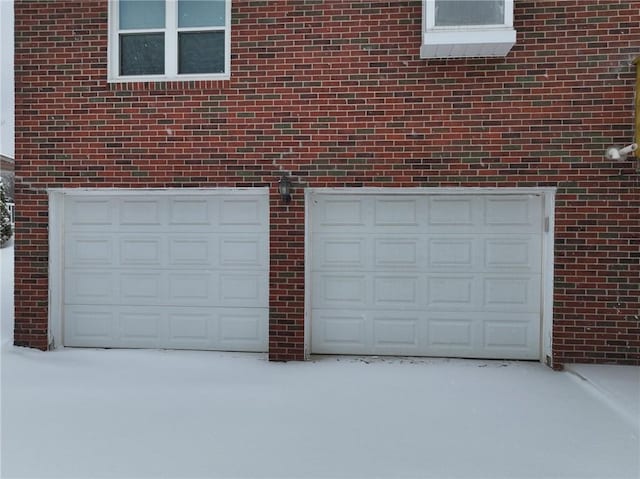 view of snow covered garage