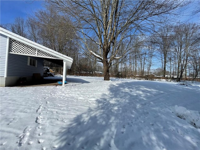 view of yard covered in snow