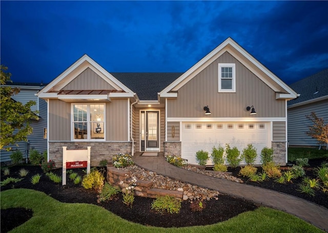 craftsman inspired home with a garage