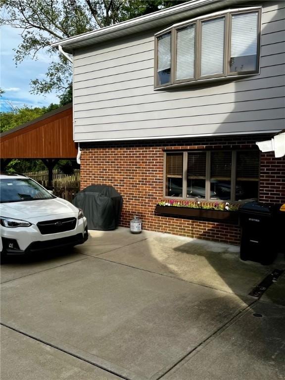 view of side of home featuring a patio area