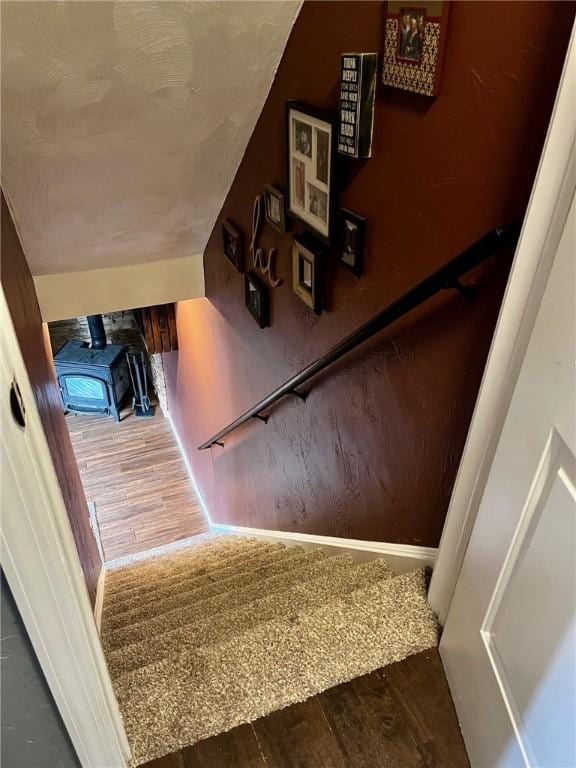 staircase with wood-type flooring