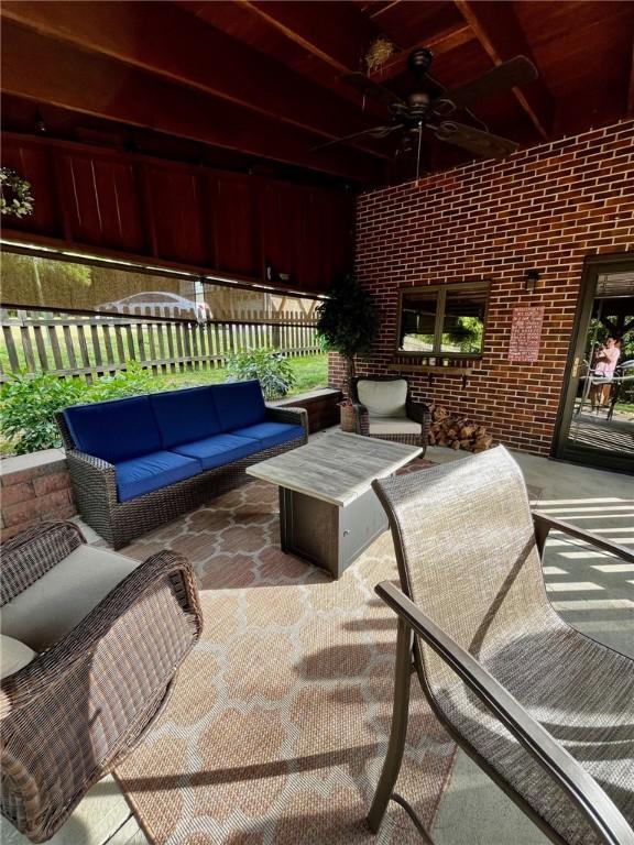 view of patio featuring an outdoor hangout area and ceiling fan