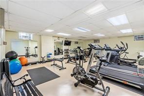 workout area with a drop ceiling