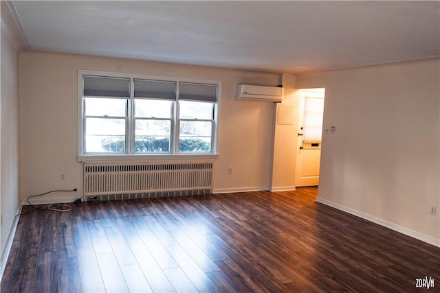 unfurnished room featuring a wall mounted AC, radiator, and dark hardwood / wood-style flooring