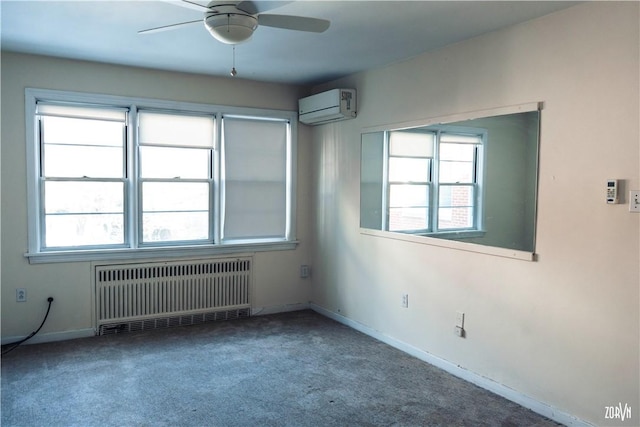 spare room featuring ceiling fan, radiator heating unit, a wall unit AC, and carpet