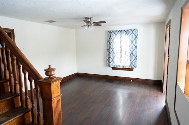 unfurnished room with ceiling fan, a textured ceiling, and wood-type flooring