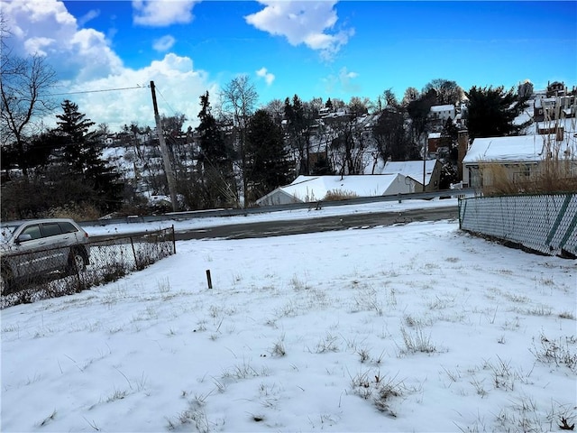 view of yard covered in snow