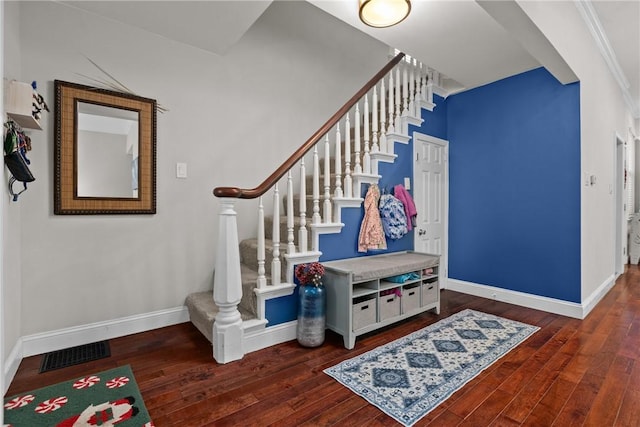 staircase featuring wood-type flooring