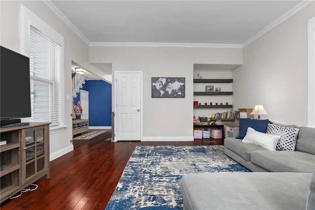 living room featuring built in features, crown molding, and dark hardwood / wood-style floors