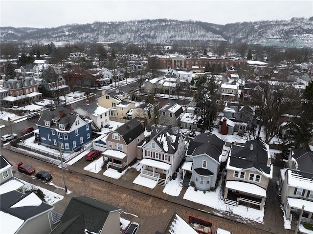 snowy aerial view with a mountain view