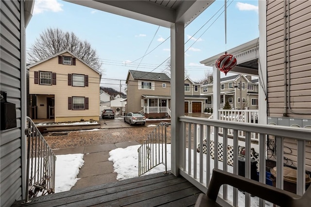 wooden terrace featuring covered porch