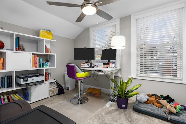 office area featuring ceiling fan, carpet flooring, and lofted ceiling