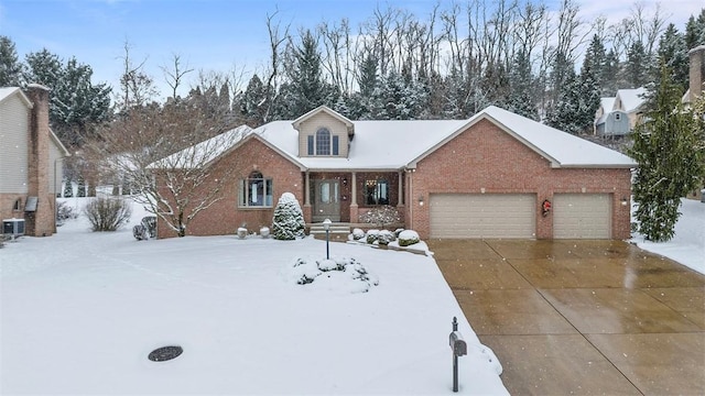 view of property with a garage and central AC