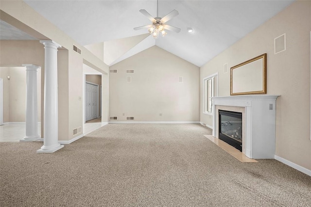 unfurnished living room with decorative columns, lofted ceiling, light carpet, and ceiling fan