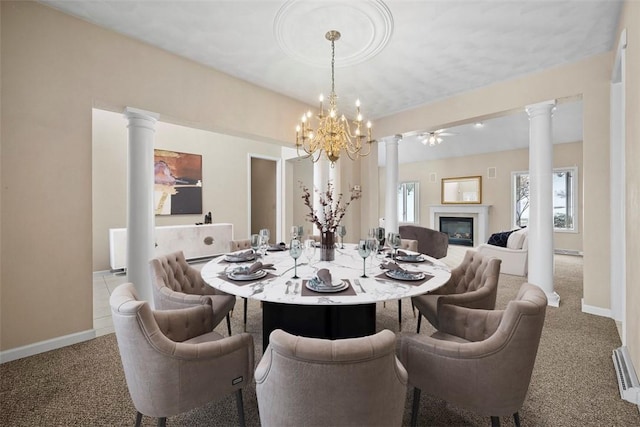 dining area with ornate columns and carpet floors