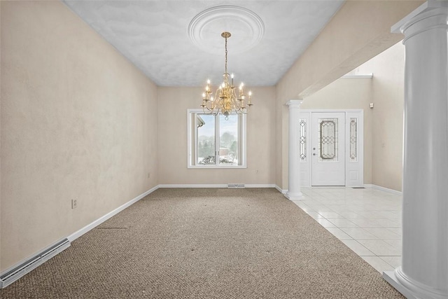 foyer entrance with decorative columns, light carpet, and an inviting chandelier