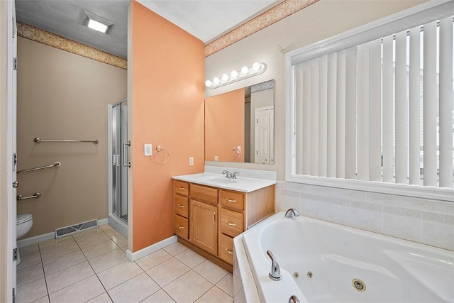 full bathroom with vanity, toilet, plus walk in shower, and tile patterned flooring