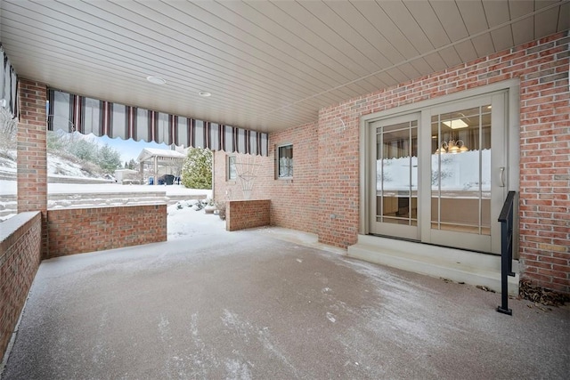 view of snow covered patio