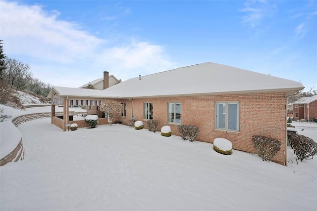 view of snow covered house