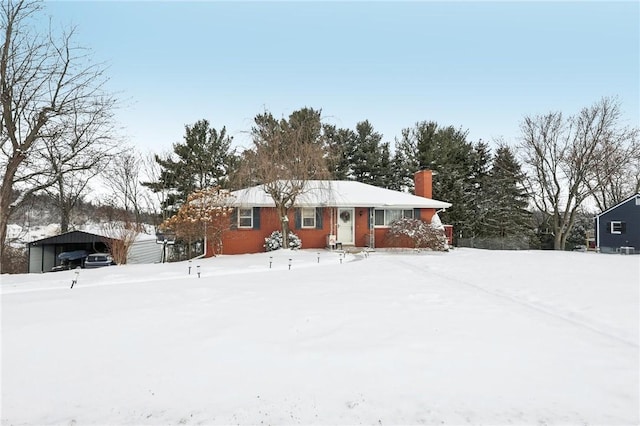 view of front of property with a carport