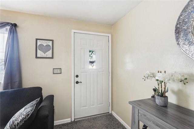 view of carpeted entrance foyer