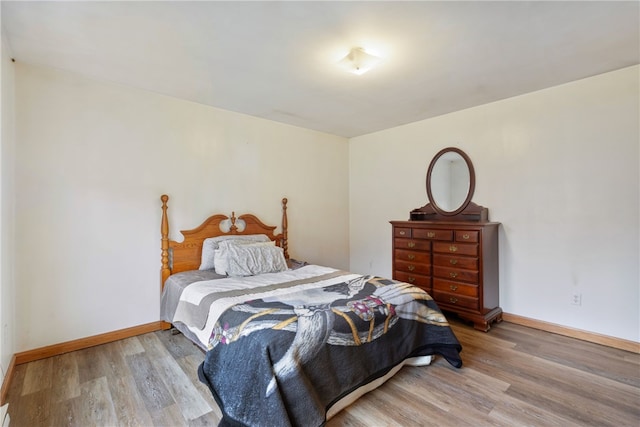 bedroom with hardwood / wood-style flooring