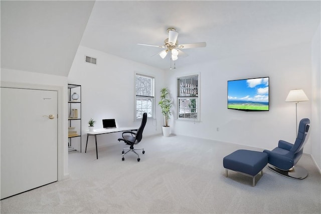 office space with light colored carpet, vaulted ceiling, and ceiling fan