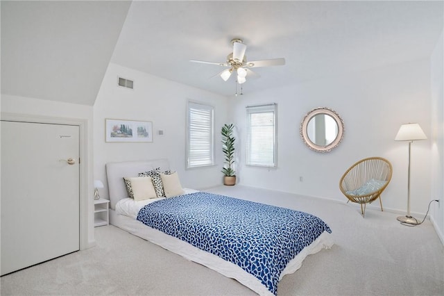 carpeted bedroom with lofted ceiling and ceiling fan