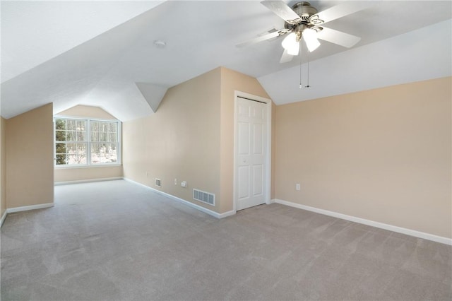 bonus room featuring light carpet, ceiling fan, and lofted ceiling