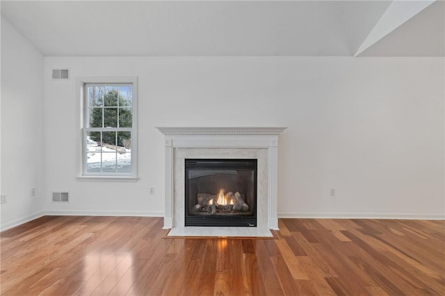 room details with a fireplace and hardwood / wood-style flooring