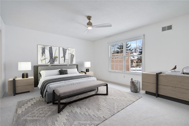 bedroom featuring ceiling fan and light colored carpet