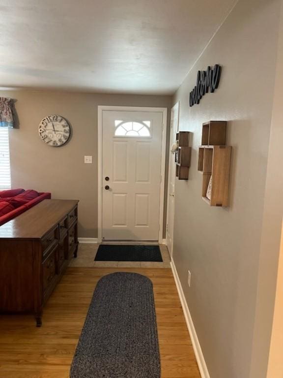 doorway to outside with light hardwood / wood-style flooring