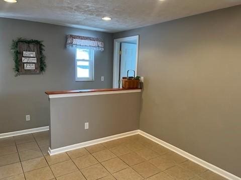 empty room with tile patterned floors