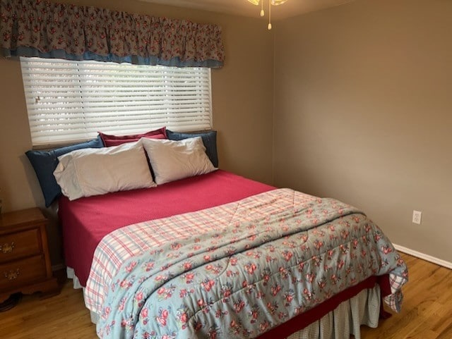 bedroom with hardwood / wood-style flooring