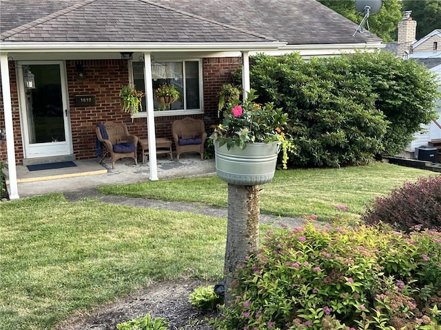 view of yard featuring a patio area and central air condition unit