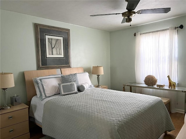 bedroom featuring ceiling fan and hardwood / wood-style floors