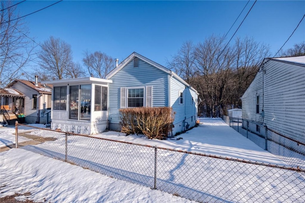 view of front of property with a sunroom