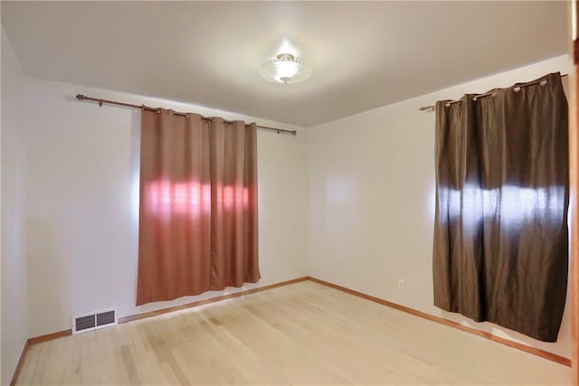 empty room featuring wood-type flooring