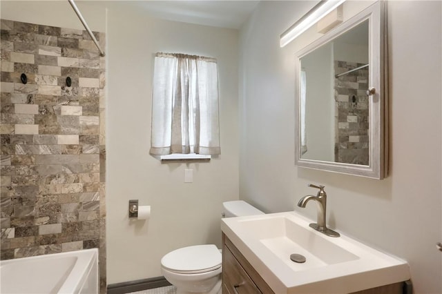 full bathroom with toilet, vanity, and tiled shower / bath combo