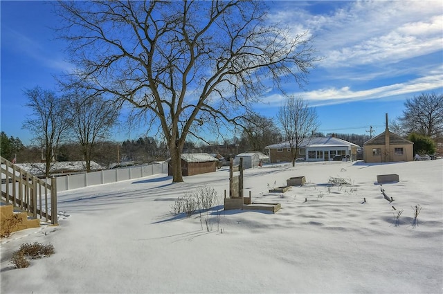 view of yard layered in snow