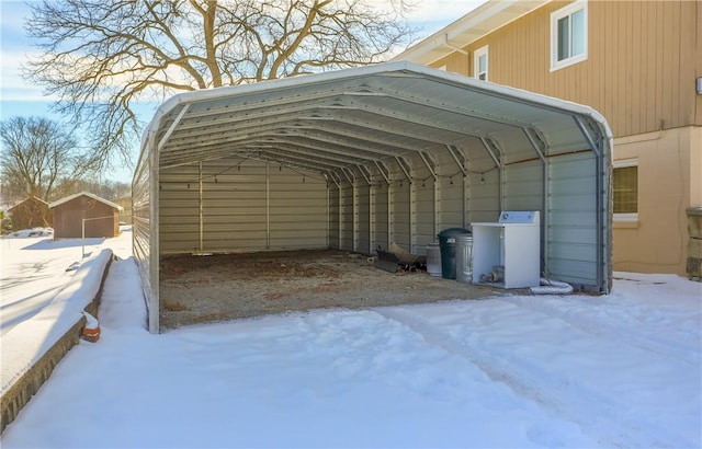 exterior space with washer / dryer and a carport