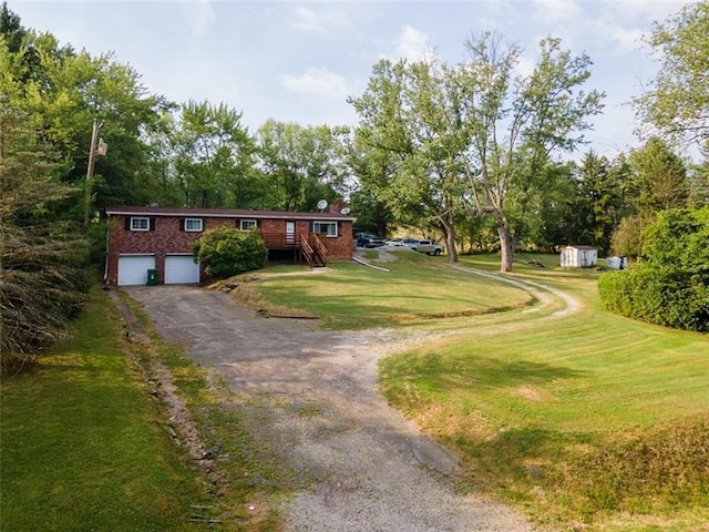 view of front facade featuring a garage and a front lawn