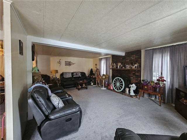 living room with a fireplace, carpet flooring, and a wealth of natural light