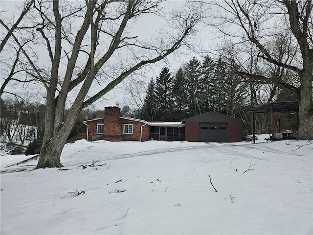 exterior space featuring a garage and an outdoor structure