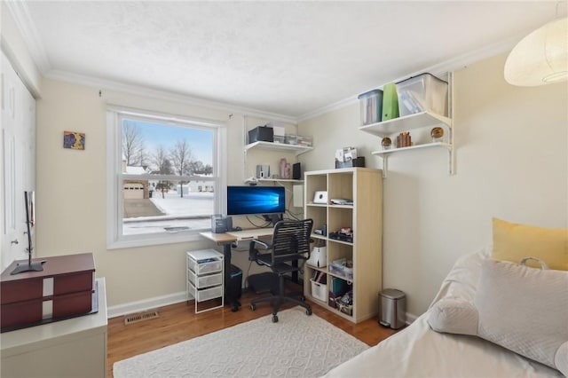 office space featuring light hardwood / wood-style flooring and ornamental molding